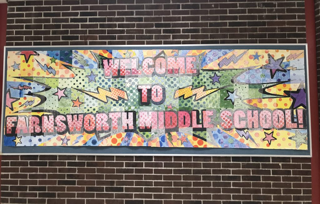 Colorful "Welcome to Farnsworth Middle School" bulletin board in the hallway