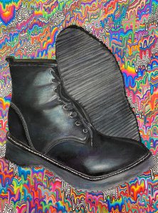 Renee Manzella Art work of black boots with colorful background