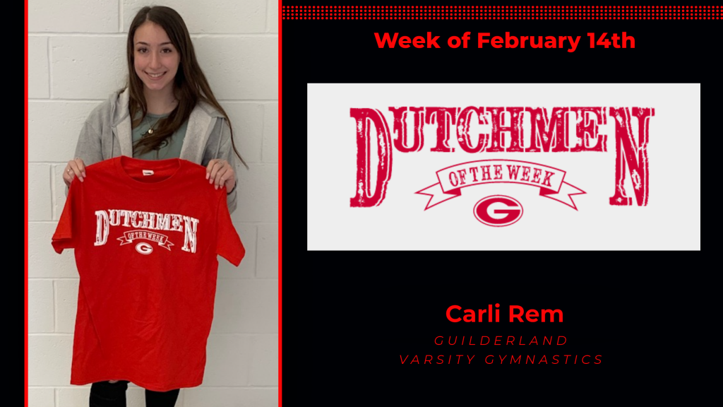 Carli Rem holding the Dutchmen of the Week award t-shirt