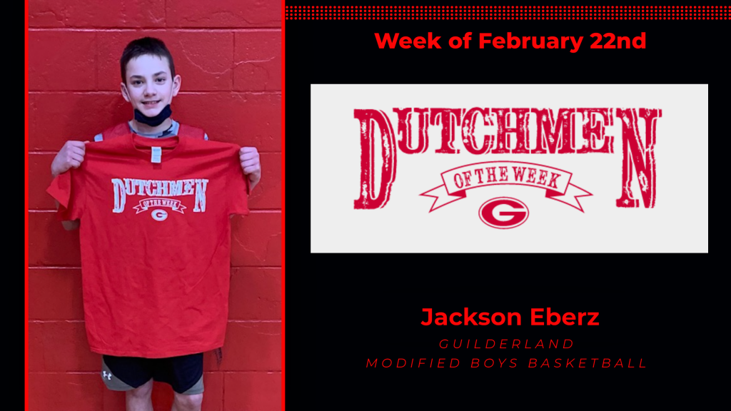 Jackson Eberz holding Dutchment of the Week Award t-shirt