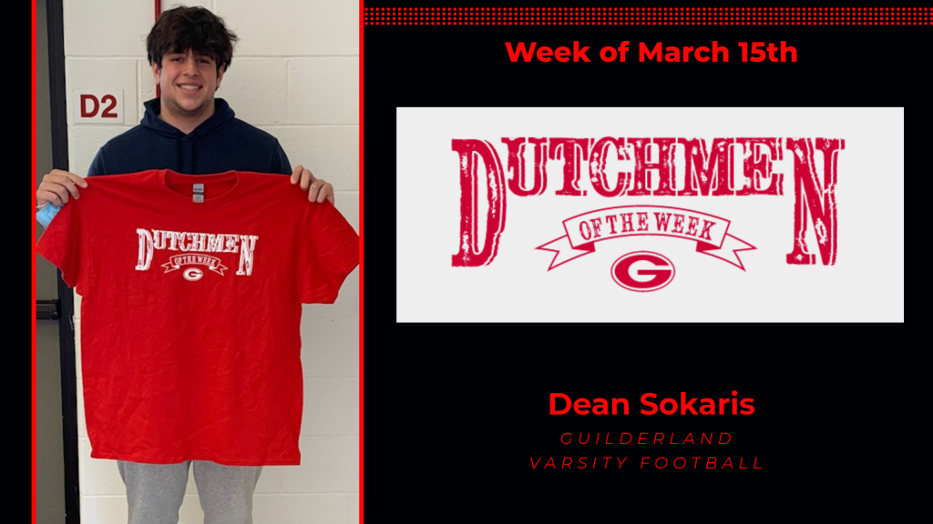 Dean holding the Dutchmen of the Week Award red t-shirt