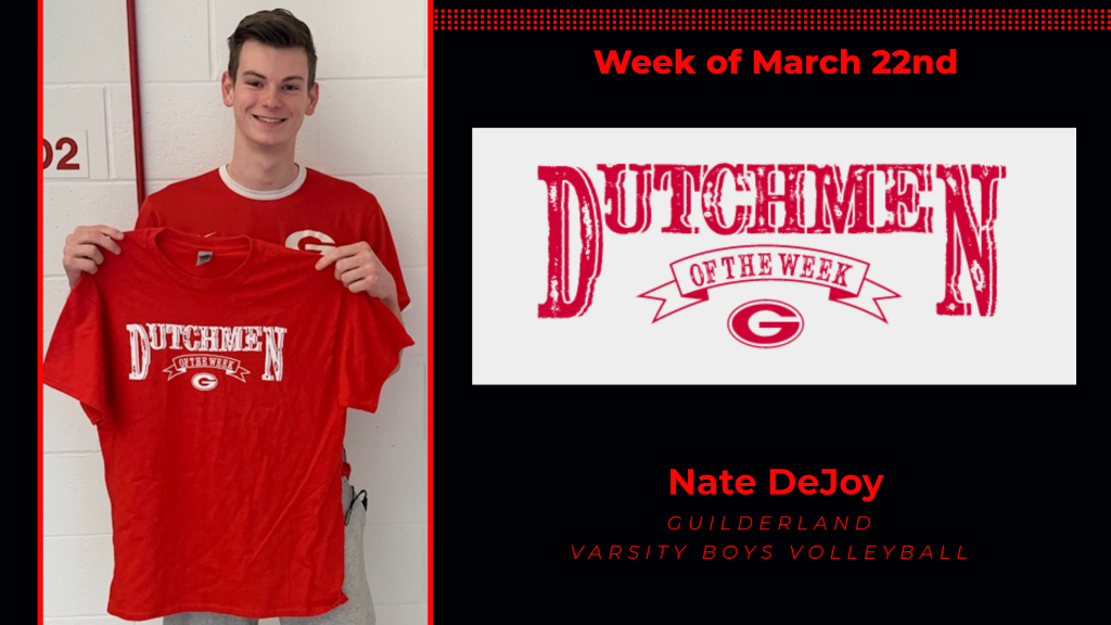 Nate holding Dutchmen of the Week t-shirt