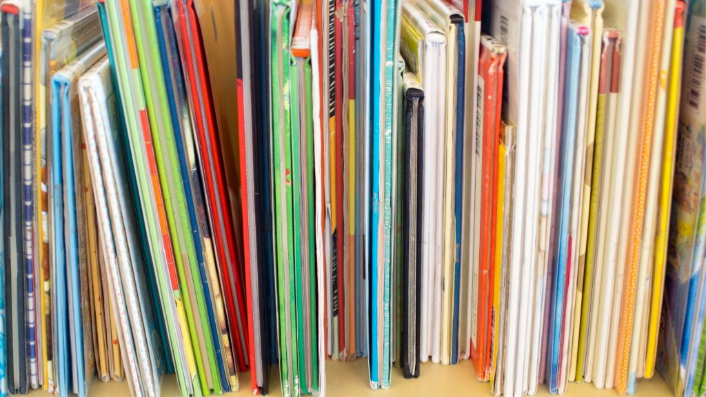 Photo of the bottom of colorful books lined up