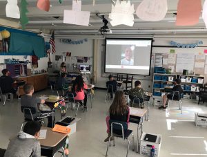 Students meet virtually with food pantry executive director.