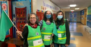 Three volunteers at vaccine clinic