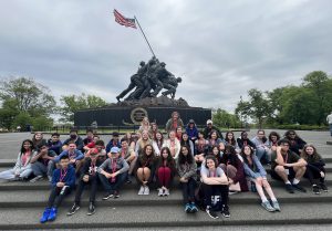 Students gathered in front of war memorial in Washington D.C.
