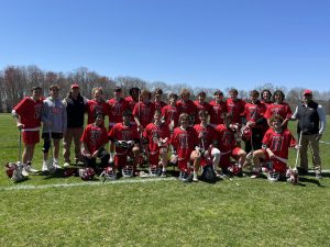 Boys lacrosse coach celebrates 200 win with team