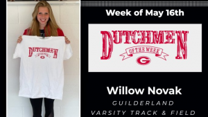 Track athlete holding Dutchmen of the Week t-shirt