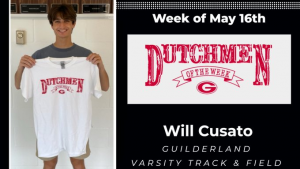 GHS track athlete holding Dutchmen of the Week t-shirt