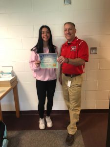 GHS student and principal holding certificate of recognition