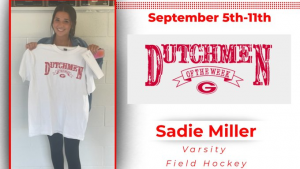 Varsity field hockey player holding Dutchmen of the Week t-shirt