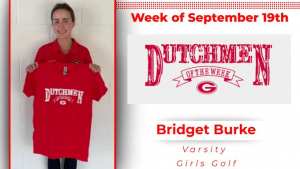 Student holding red t-shirt that says "Dutchmen of the Week"