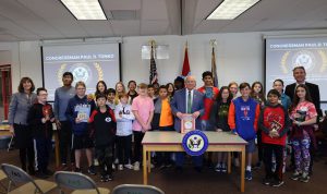 U.S. Rep. Tonko with a group of students holding books