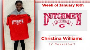 Christina Williams posing for photo, holding Dutchmen of the Week t-shirt