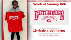 Christina Williams posing for photo, holding Dutchmen of the Week t-shirt