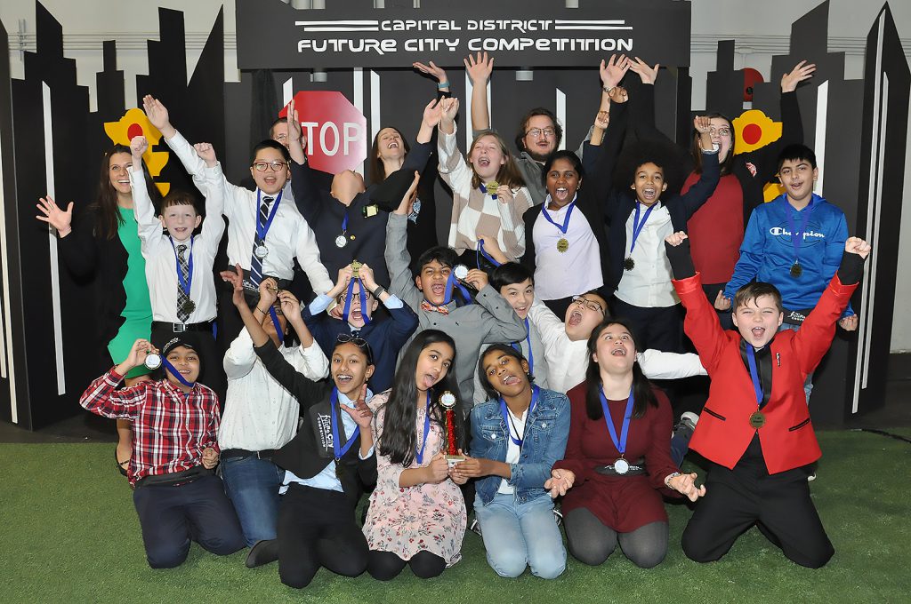 Students excitedly posing for a group photo.