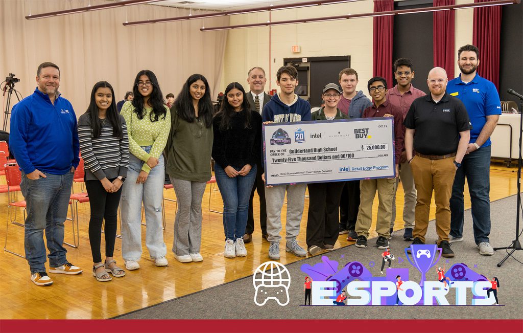 Students holding a giant check.