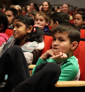 Student listens intensely at the Young People's Concert