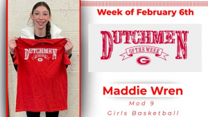 Student holding Dutchmen of the Week t-shirt