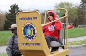 Student participates in seat belt convincer