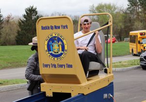 Student participates in seat belt convincer
