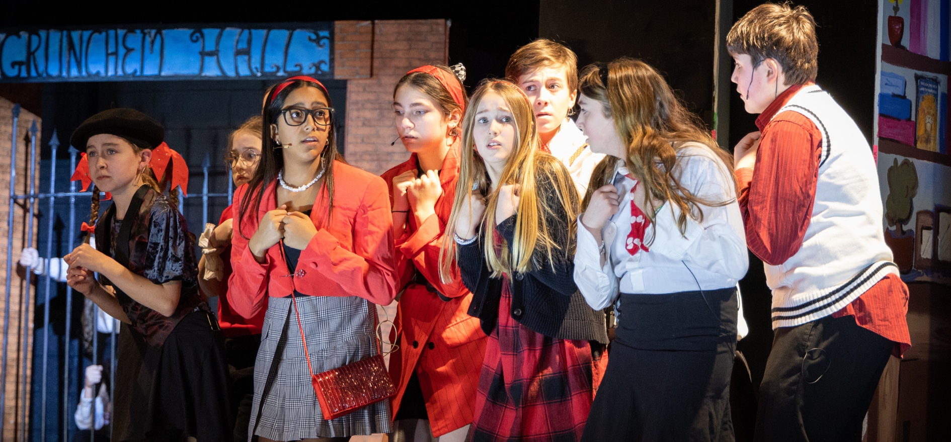 Middle school students perform a scene during the dress rehearsal of Matilda Jr.