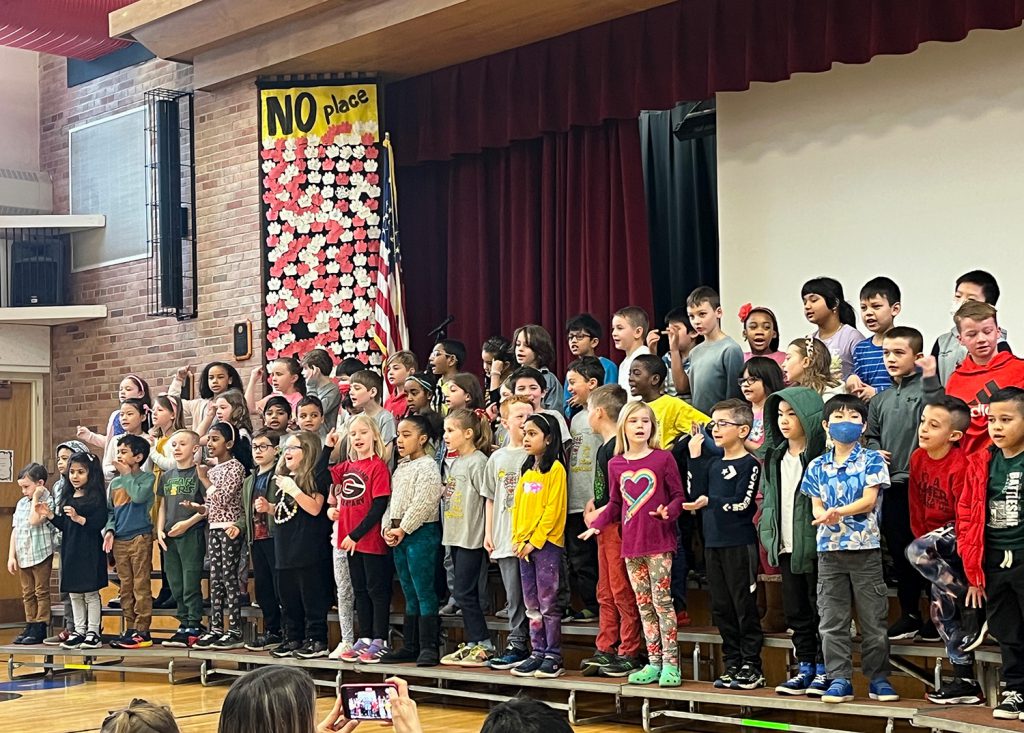 Students performing on stage.