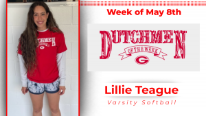 A student stands in front of a white wall, wearing a red t-shirt. The t-shirt has white type that reads Dutchmen of the Week