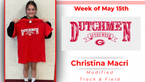Students stands in front of a white wall, holding a red t-shirt. The student is smiling. The white text on the t-shirt reads: Dutchmen of the week. The photo is in a graphic that reads: Dutchmen of the Week Christina Macri Modified Track & Field