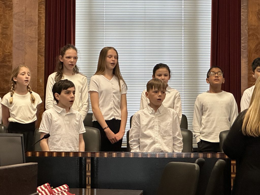 Close up photo of a few members of the PBES select chorus performing at a naturalization ceremony at the US federal courthouse.