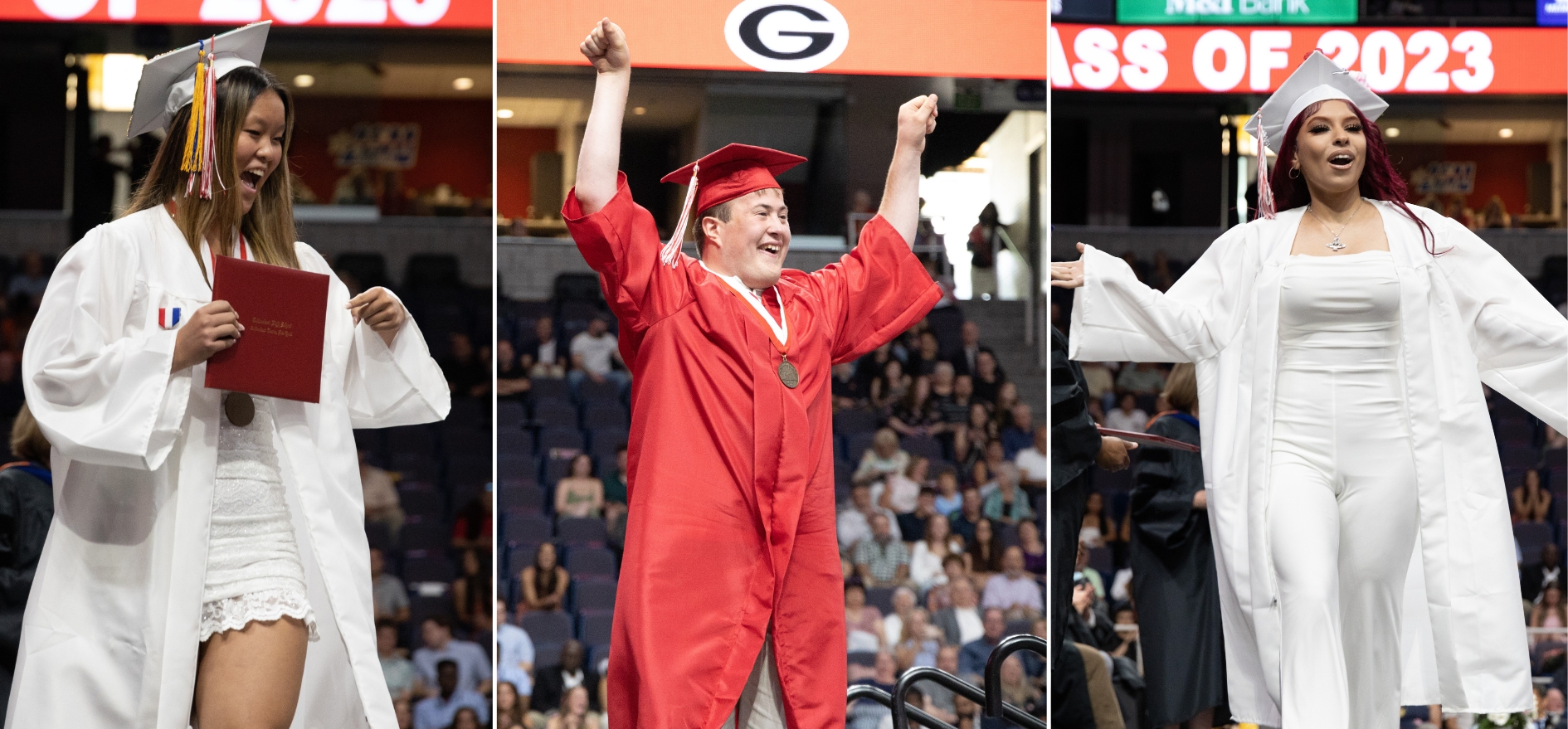 Graduates strike poses as the cross the stage at commenecement