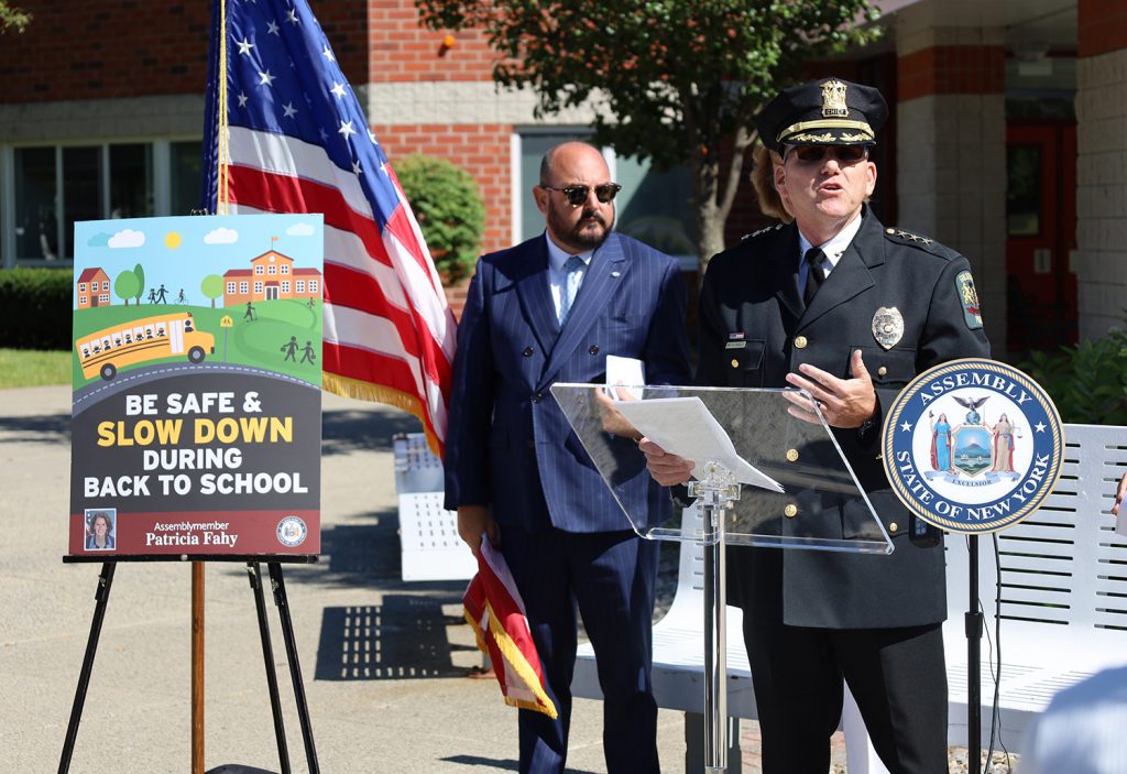 Police Chief speaking at the podium.