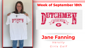 Student is smiling holding a white t-shirt that reads Dutchmen of the Week