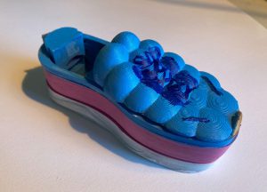 Close up image of 3D printed blue shoe designed by student