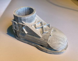 Close up image of 3D printed grey shoe designed by student