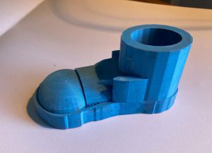 Close up image of 3D printed blue shoe designed by student