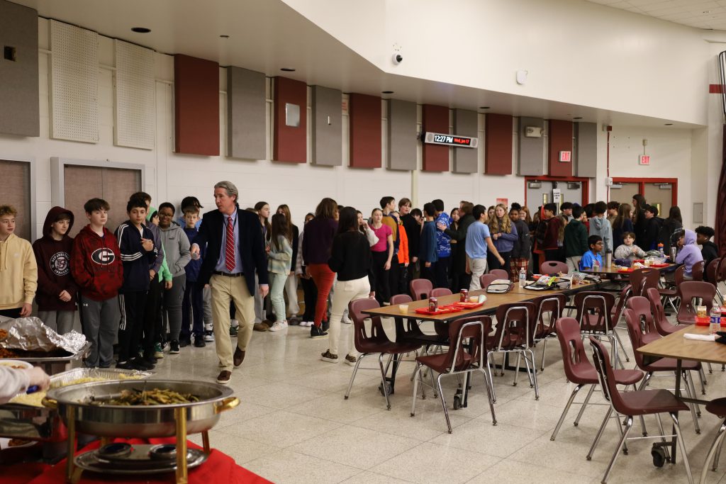 Students lined up to sample food.