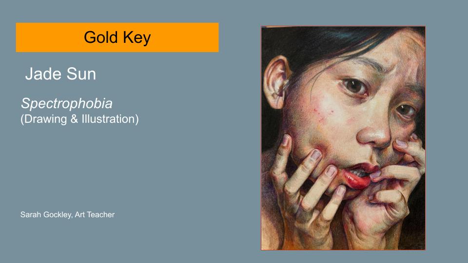 Text reads: Gold Key, Jade Sun, Spectrophobia (Drawing & Illustration) Sarah Gockley, Art Teacher. Image is of a piece of artwork. It's of a young woman's face; she has a look of concern. She is holding her face in her hands.