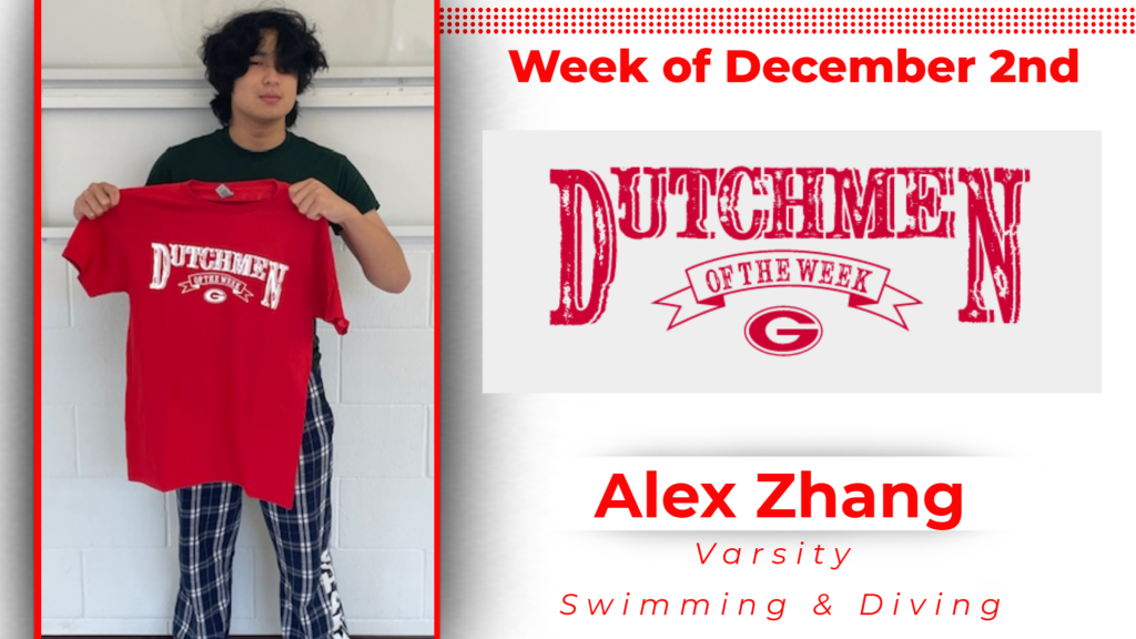 Student smiling holding up a tshirt for Dutchmen of the Week.