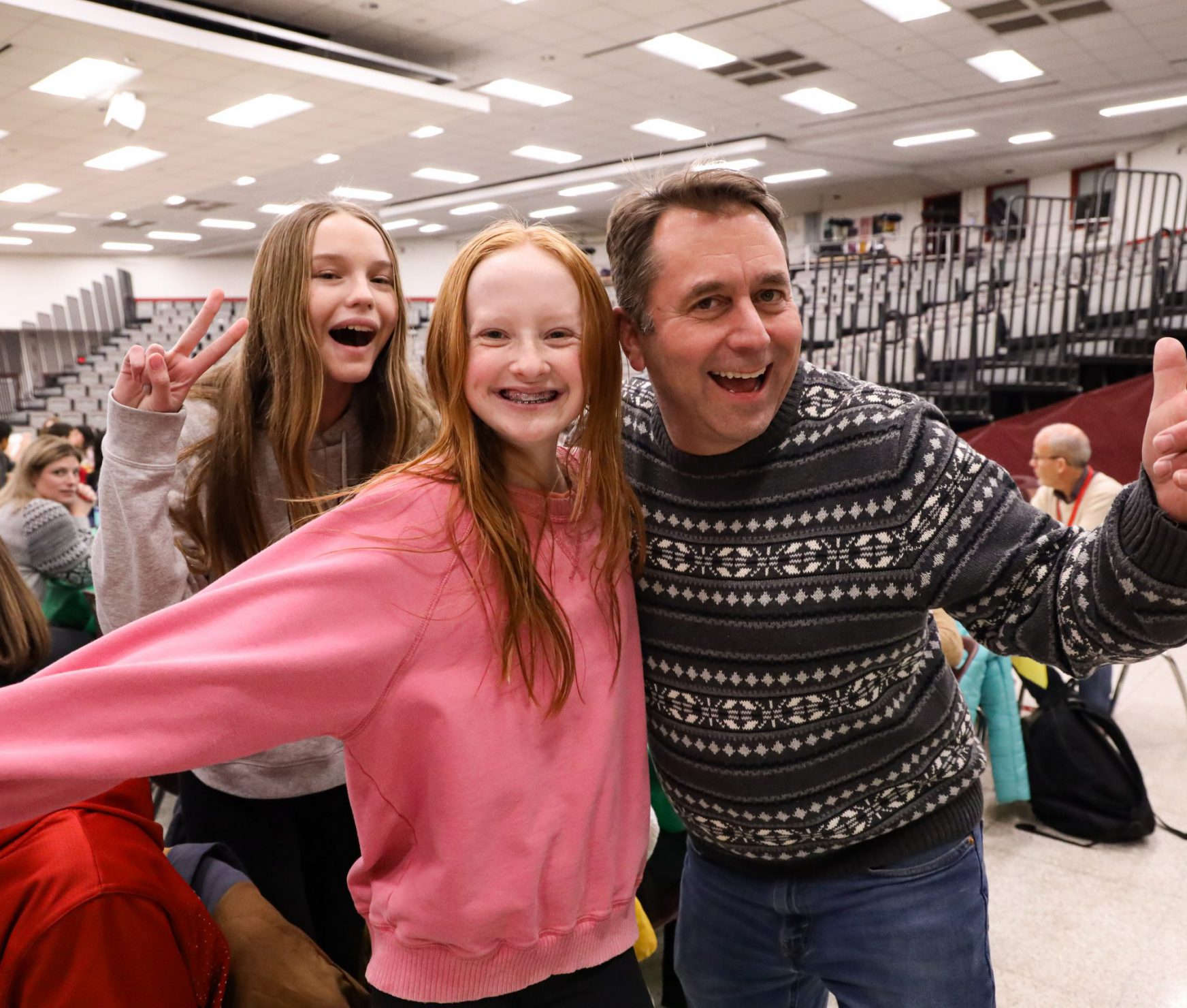 FMS students smiling with a teacher.