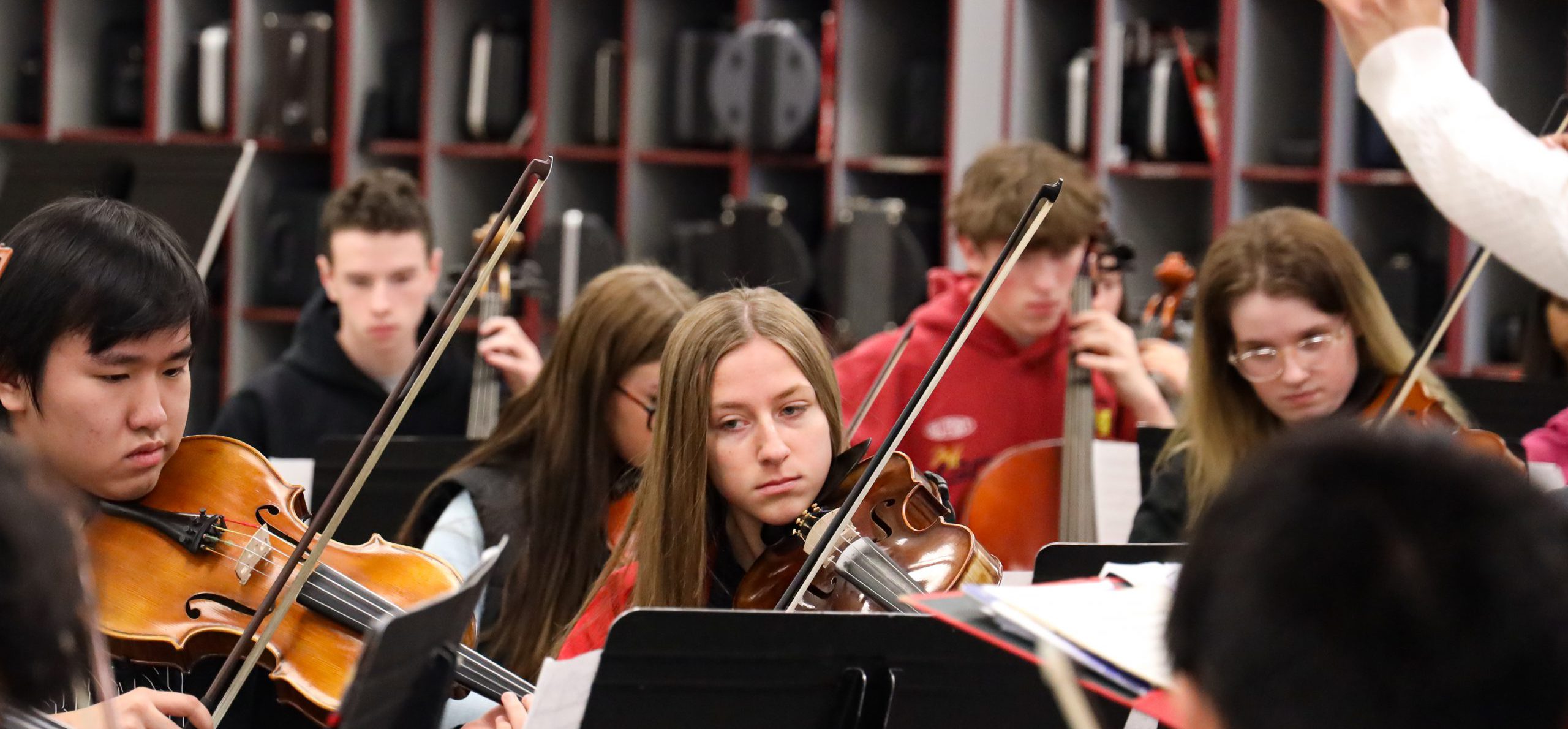 GHS students in orchestra class. They are rehearsing a song.