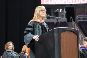 Superintendent Wiles speaks at a podium at MVP Arena