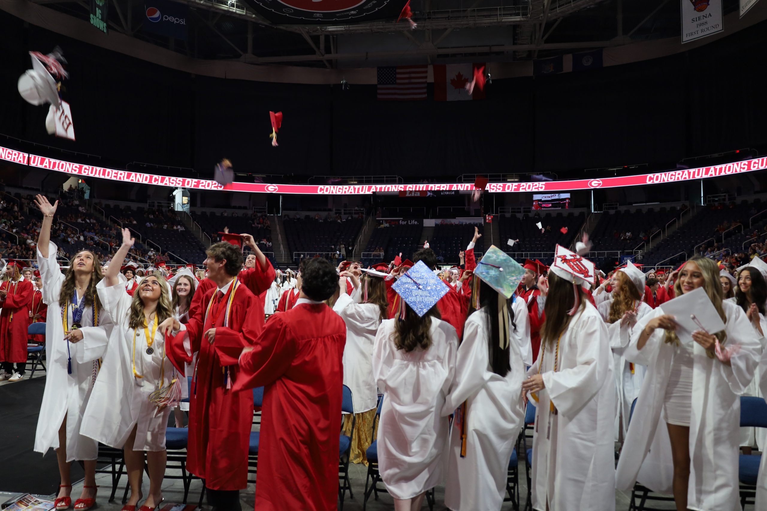 Graduates are throwing their caps in the air