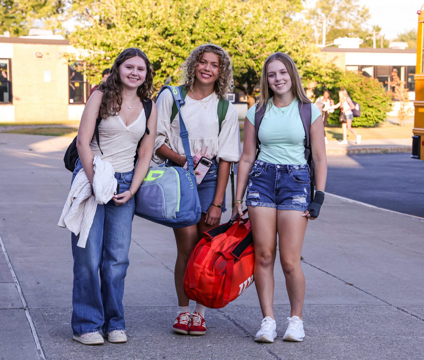 Three GHS students on the first day. They are standing outside of the school.