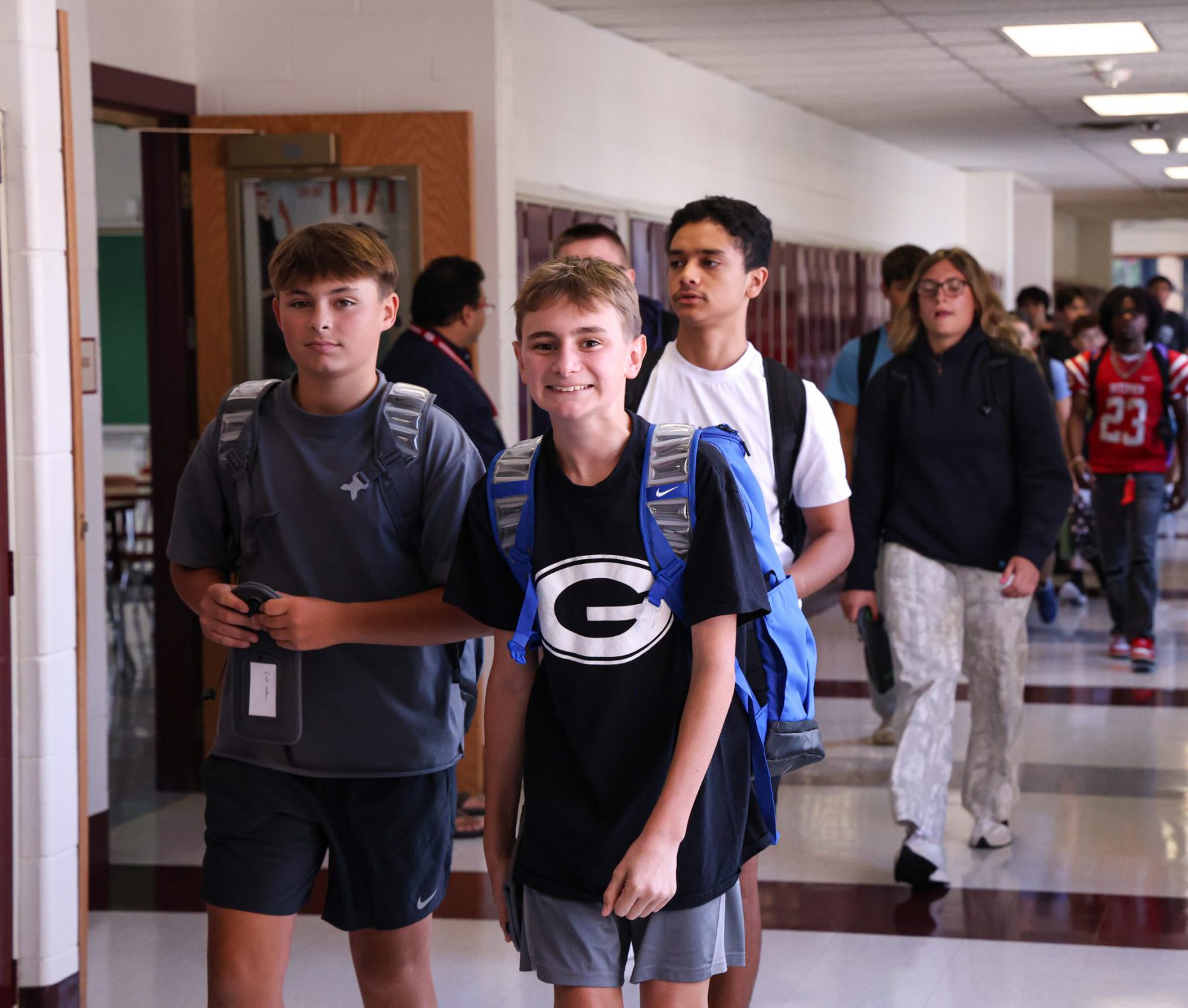 Students smiling in the halls.
