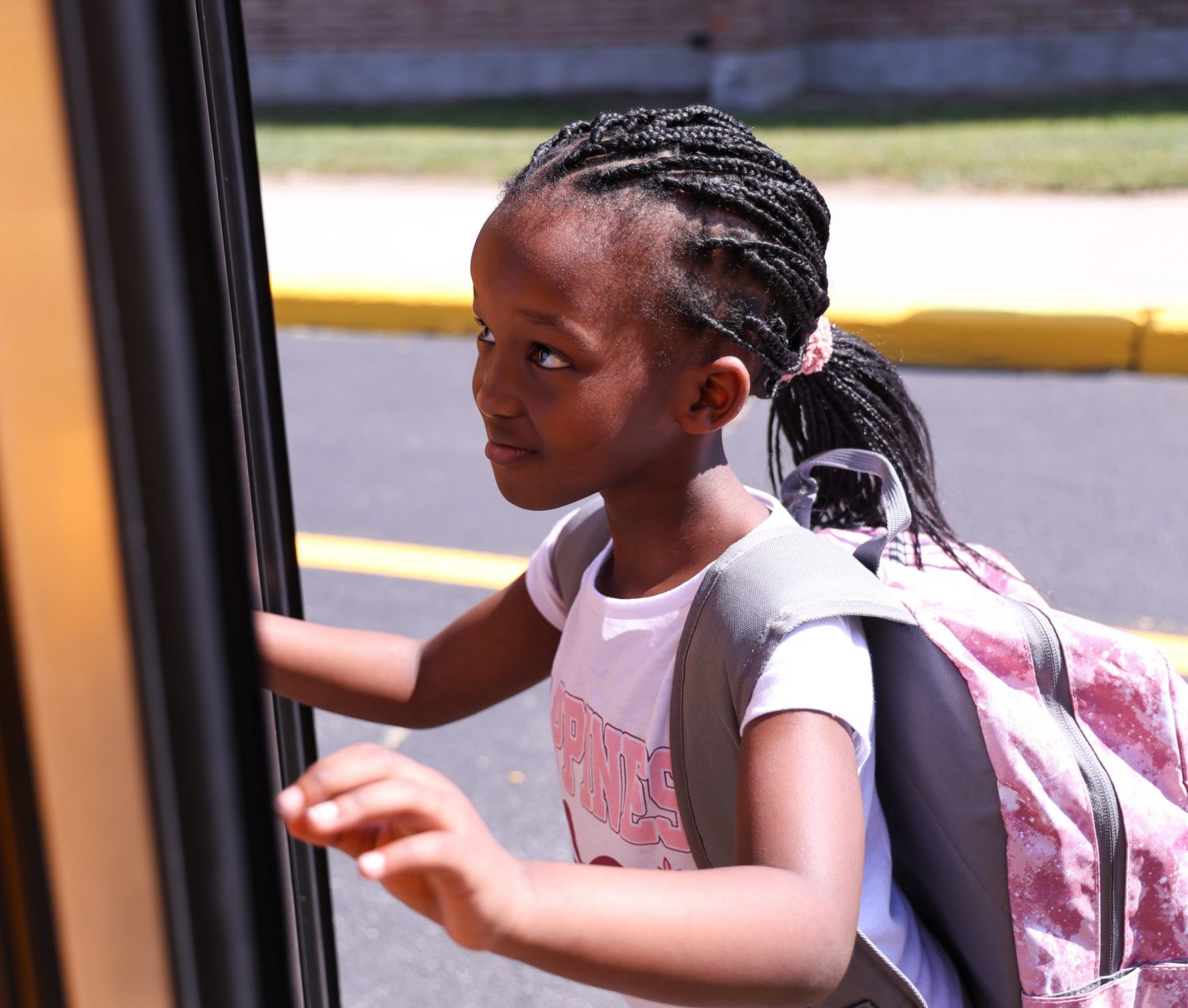 WES student going onto bus.