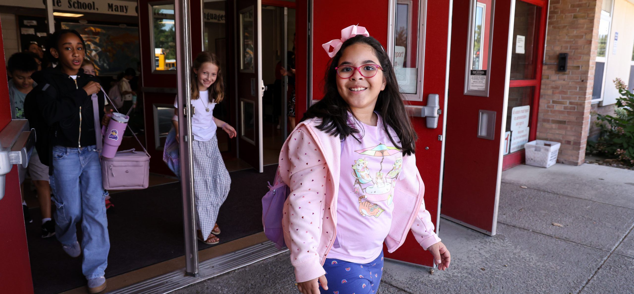 Elementary student smiling on the first day of school.