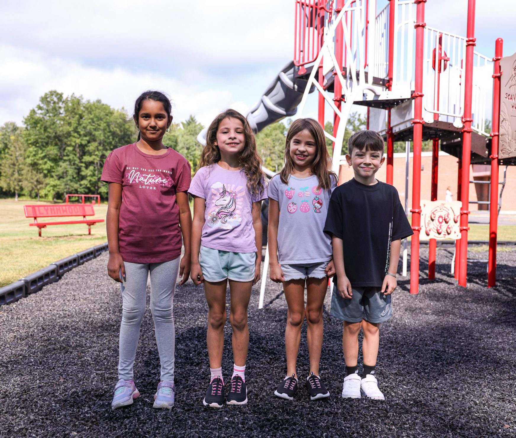 LES students smiling on the playground.