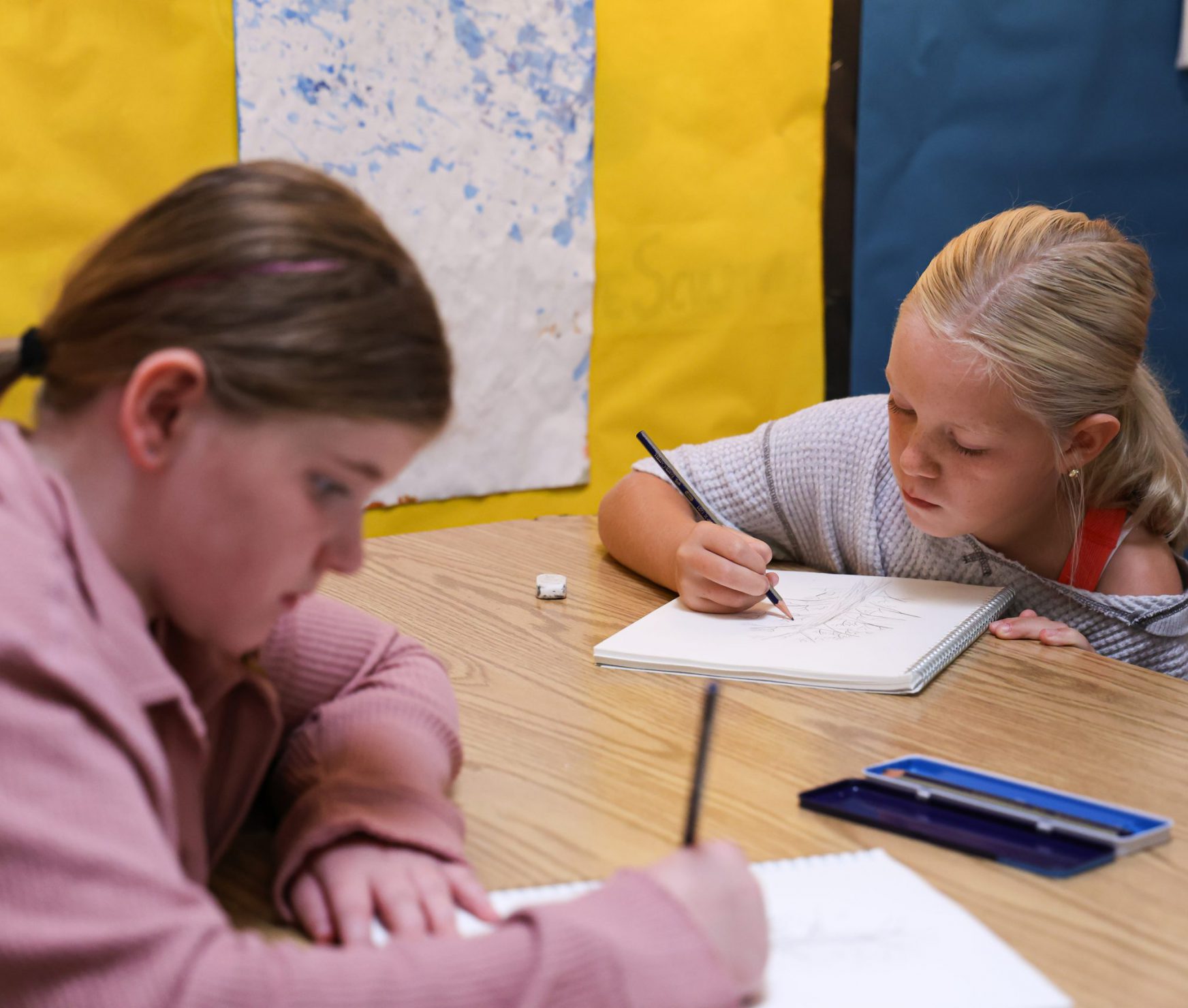 PBES students drawing in art class.