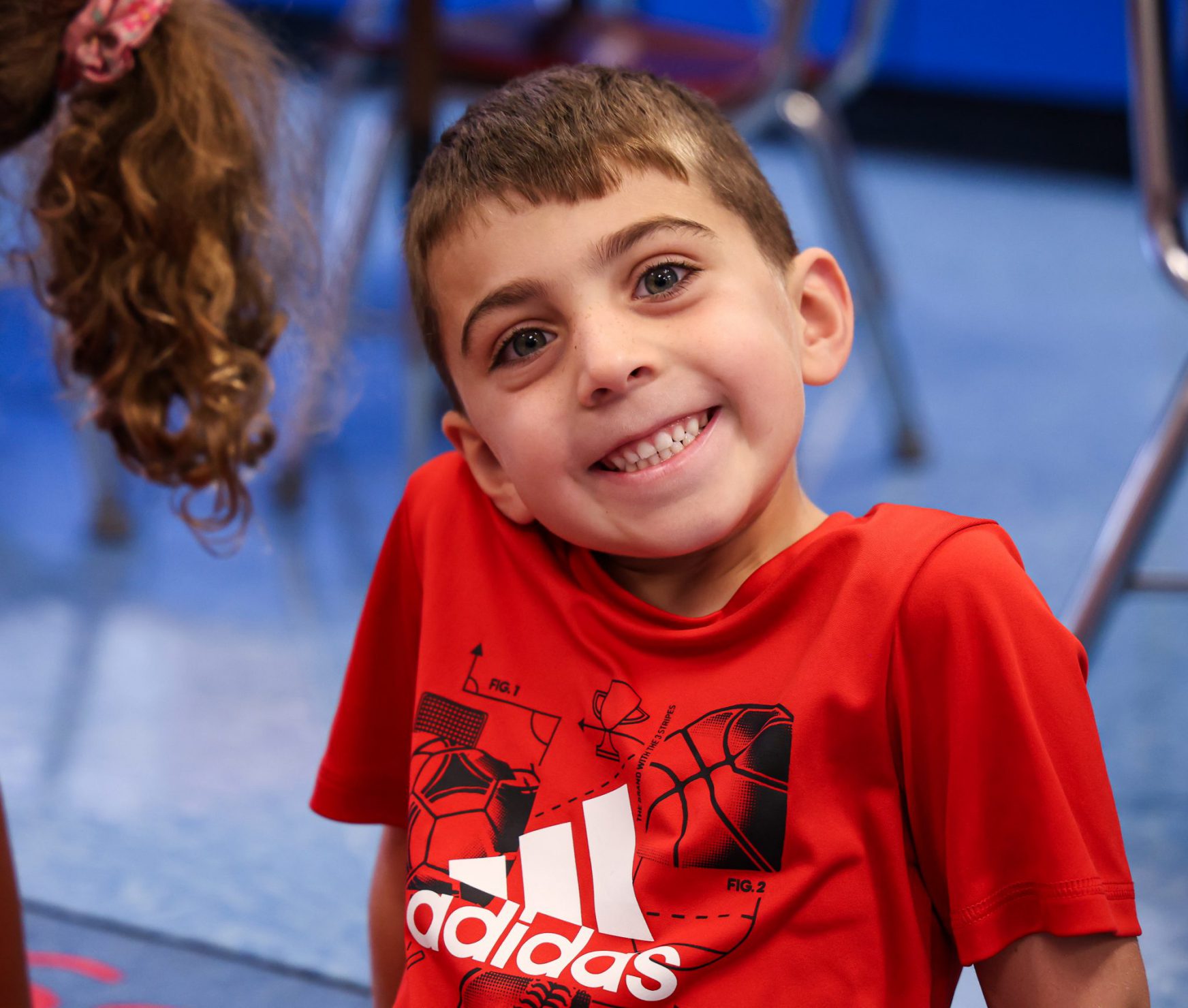 PBES student smiling in class.